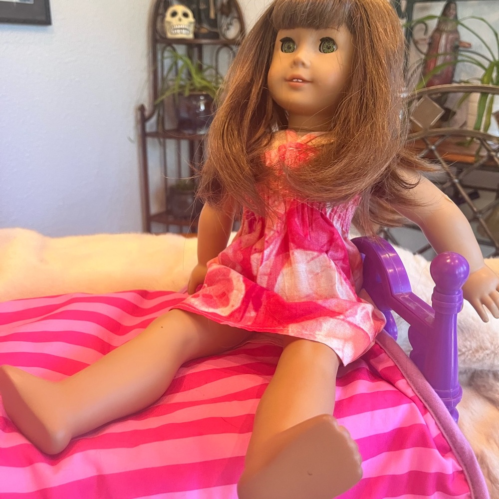Gently used American Girl Doll. Brown hair and green eyes. Doll only